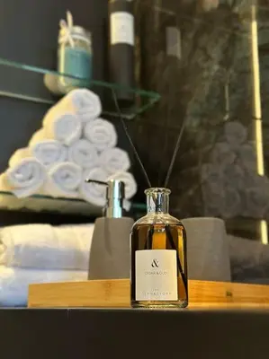 a bottle of whiskey on a table in a room at Luxurious in Abdoun Tower at 11th Floor in Amman