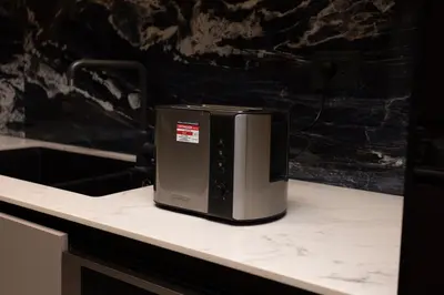 a microwave sitting on top of a kitchen counter at Luxurious in Abdoun Tower at 11th Floor in Amman