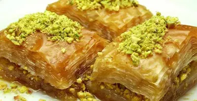 a close up of a piece of food with nuts on it at look house in Amman