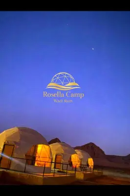a group of tents in the desert at night at Rosella Camp Wadi Rum in Wadi Rum
