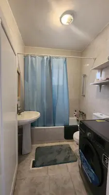 a bathroom with a sink and a toilet and a shower at Blackbird Sanctuary homestay & Art Cafe in Ajloun