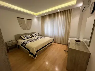 a hotel room with a bed and a window at Casa De Centre 1 in Amman