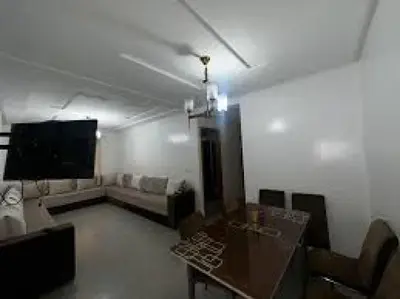 a living room with a couch and a table at 89 inn in Amman