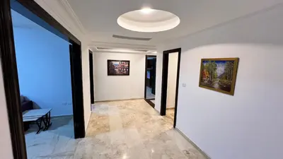 a hallway with a white wall and a ceiling at شقة مفروشة اربع غرف نوم عبدون in Amman