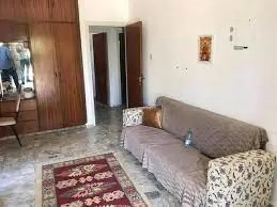 a living room with a couch and a rug at lomez House in Amman