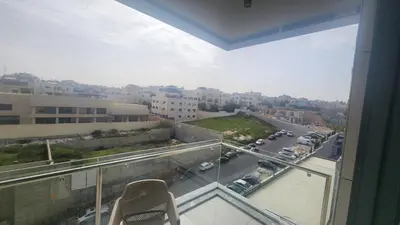 a balcony with a view of a city street at Amazing new apartment in the middle of Amman in Amman
