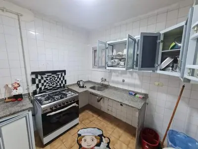 a kitchen with a toy dog on the floor at La bedouin in Amman
