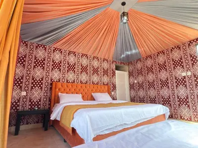 a bedroom with two beds in a tent at Fadi camp in Wadi Rum