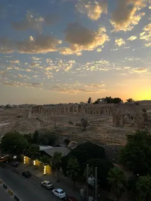 a view of a desert with cars parked on a road at Jerash Hotel in Jerash