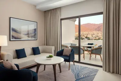 a living room with a couch and a table at The Westin Saraya Aqaba Resort & Spa in Aqaba