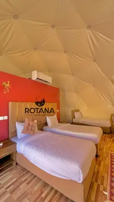 a room with two beds in a tent at Rotana luxury camp in Wadi Rum