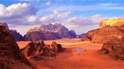 a view of a desert with rocks and mountains at Msek wadi rum camp in Disah