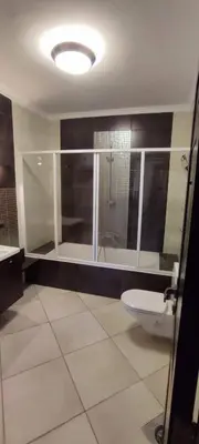 a bathroom with a toilet and a shower and a sink at Lotees House in Udhruḩ
