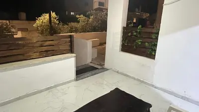 a view of a balcony with a black rug on the floor at Bait Al-Masri in Um Qeis
