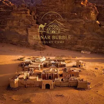 a group of buildings in the middle of a desert at Manar Bubbel Luxury Camp in Wadi Rum