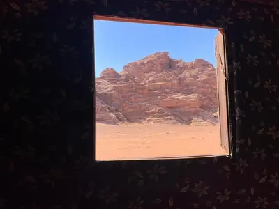 a window in a room with a view of the desert at Um sabatah camp in Wadi Rum