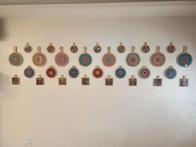 a group of plates hanging on a wall at New Rafi Hotel in Amman