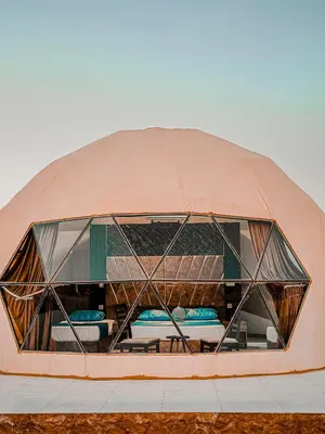 a large domed building with a window on it at Rum Ronaldo camp in Wadi Rum