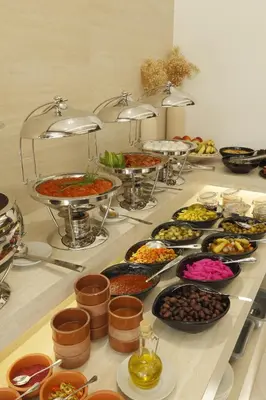 a buffet with many different types of food on a table at G Hotel Amman in Amman