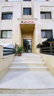 a building with stairs in front of a building at Apartment in Amman Abdoun area in Amman