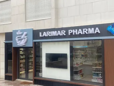 a store front with a sign for a pharmacy at Modern Rooftop apartment in Amman
