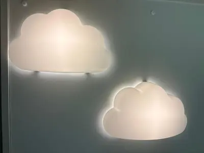 two white cloud lights hanging on a wall at Nozoll Boutique Residences in Amman