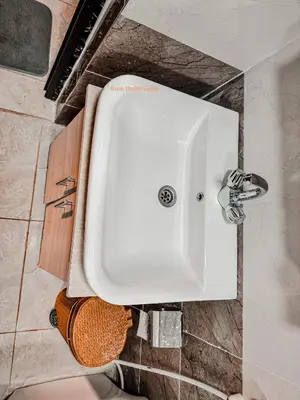 a white sink in a bathroom with at Rum thabit camp in Wadi Rum