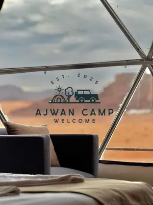 a sign on the window of a canyon camp welcome at WADI RUM AJWAN lUXURY CAMP in Wadi Rum
