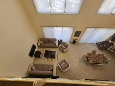 an overhead view of a living room with furniture at B35 Samarah Resort LOFT apartment in Sowayma