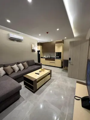 a living room with a couch and a table at Chic Apartments For Rent ave2-5 in Amman