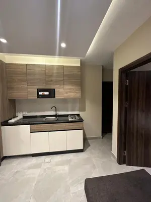 a kitchen with a sink and a counter top at Chic Apartments For Rent ave2-8 in Amman