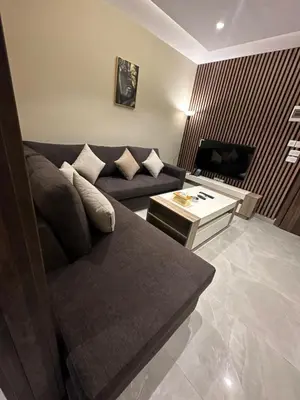 a living room with a couch and a table at Chic Apartments For Rent ave2-8 in Amman