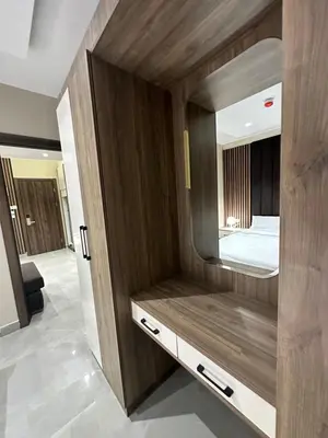 a bedroom with a bed and a large mirror at Chic Apartments For Rent ave2-8 in Amman