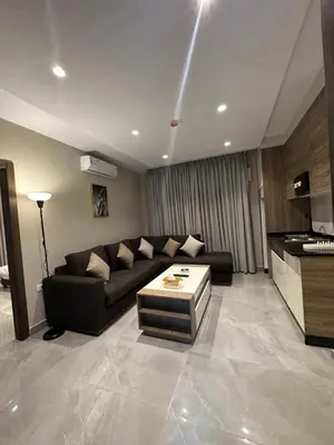 a living room with a couch and a table at Chic Apartments For Rent ave2-9 in Amman