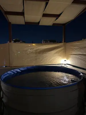 a jacuzzi tub in a building at night at Rooftop pool with terraces F-R in Amman