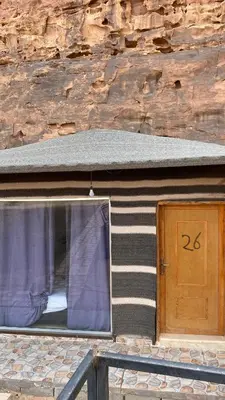 a house with a window and a door at Ali with the stars in Wadi Rum
