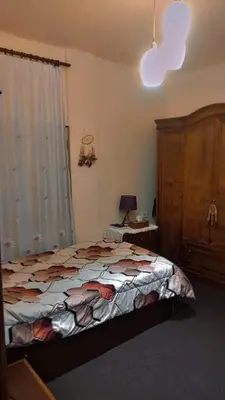 a bedroom with a large bed and a window at soon inn in Petra