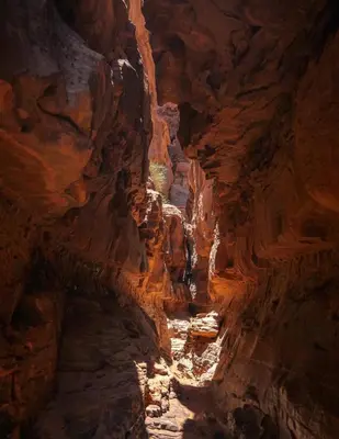 a cave with a path in a canyon at Wadi rum magical in Wadi Rum