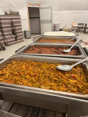 a bunch of food in trays in a room at RADISSON lUXURY RUM CAMP in Wadi Rum