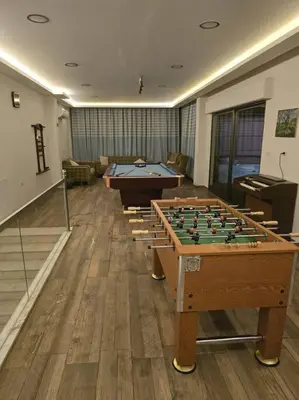 a room with billiard tables in a room at Jumeirah Chalet جميرا شاليه in Amman