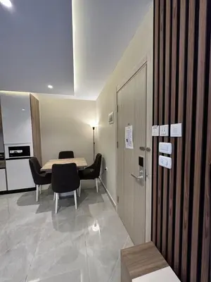 a room with a table and chairs and a table and a door at Chic Apartments For Rent ave0-5 in Amman