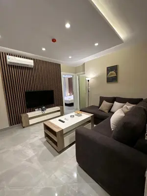 a living room with a couch and a coffee table at Chic Apartments For Rent ave0-6 in Amman