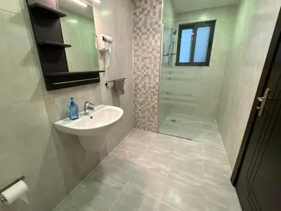a bathroom with a sink and a shower at 2 En-suite Rooms, Central & Garden Terrace in Amman