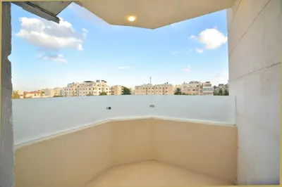 a room with a window with a view of a city at رمّ للأجنحة Rum Royal Suites in Irbid