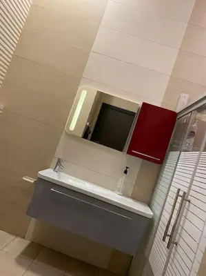 a bathroom with a sink and a mirror at villa rose3 in Mūbiş