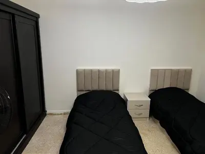 two mattresses in a room with two beds at شقة للإجار في الجاردنز in ‘Urjān al Gharbīyah