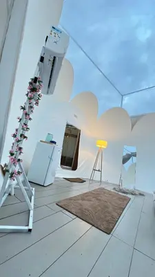 a room with a white tent with a rug at منتجع برمودا Bermuda resort in Ajloun