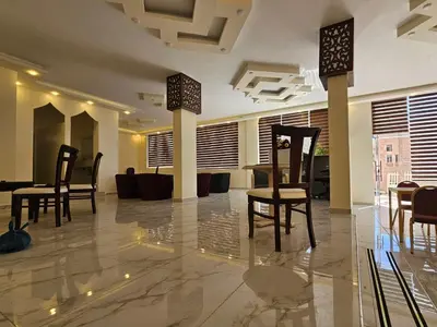 a lobby with chairs and tables in a building at Petra Summit Hotel in Petra