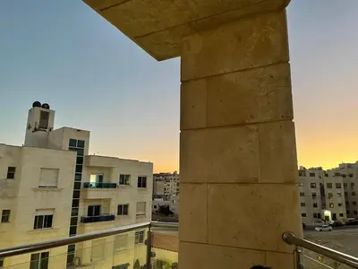 a view from the balcony of a building at السابع in Amman