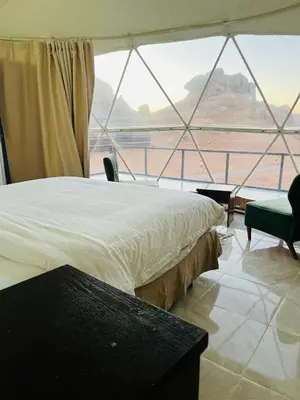a bedroom with a bed and a large window at Moon rum 2 in Disah